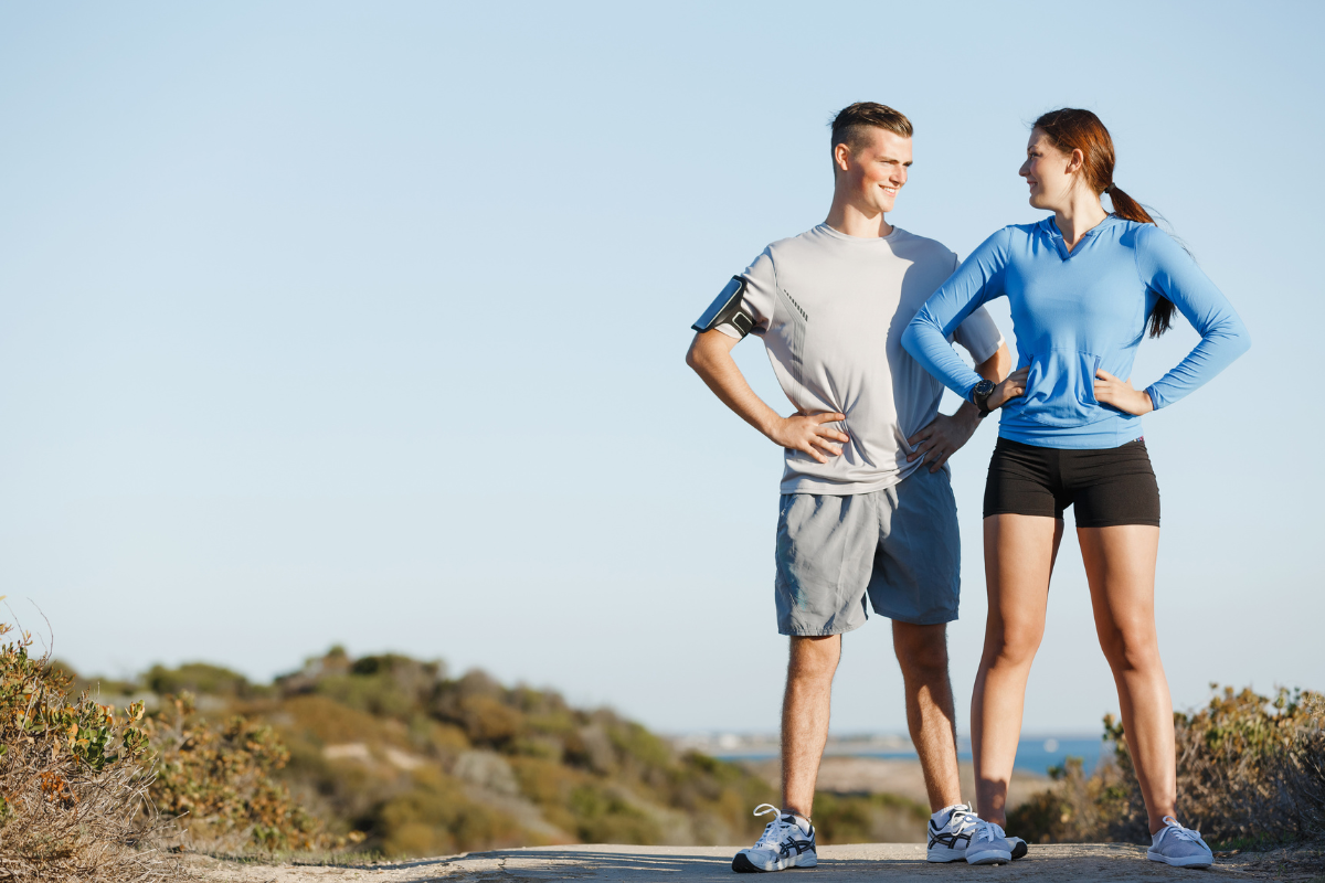 two people outside exercising
