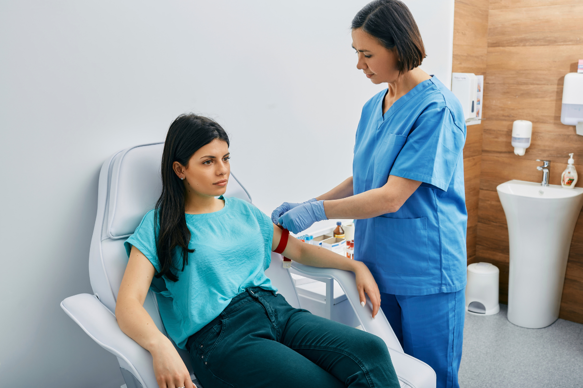 Nurse taking blood